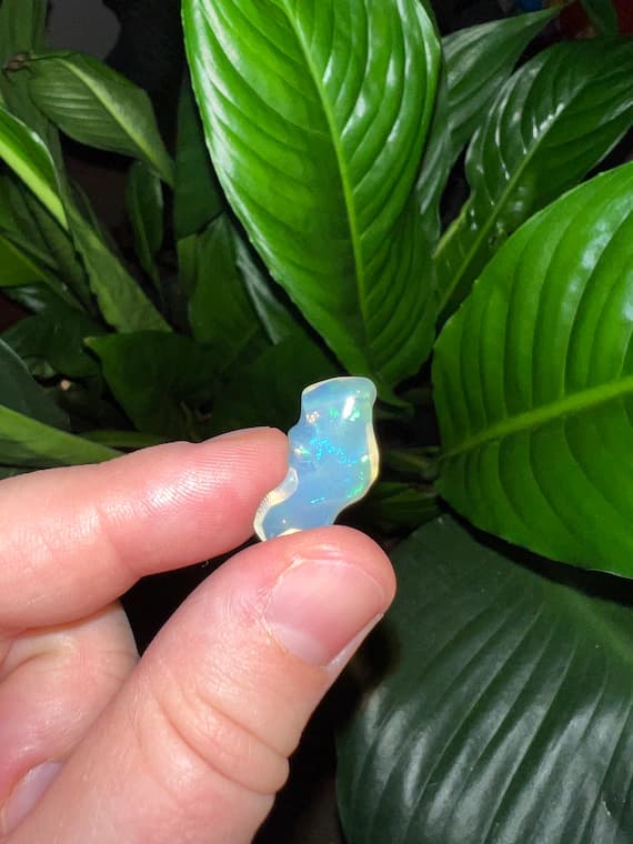 Tumbled Ethiopian opal with rainbow flash