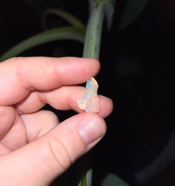 Tumbled Ethiopian opal with rainbow flash